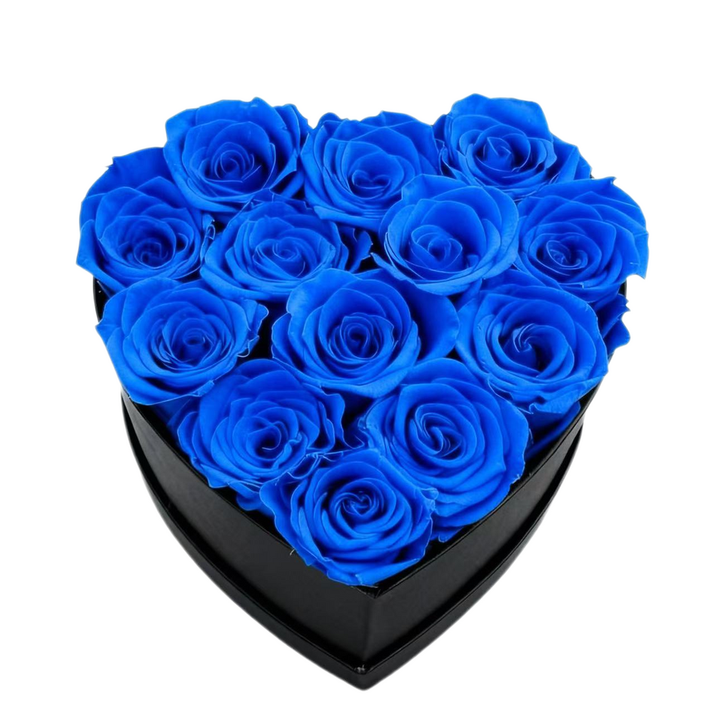 A luxurious heart box filled with 13 or 20 handcrafted forever roses, featuring a Parisian black hat-box design with gold detailing. Bloom 3+ years.