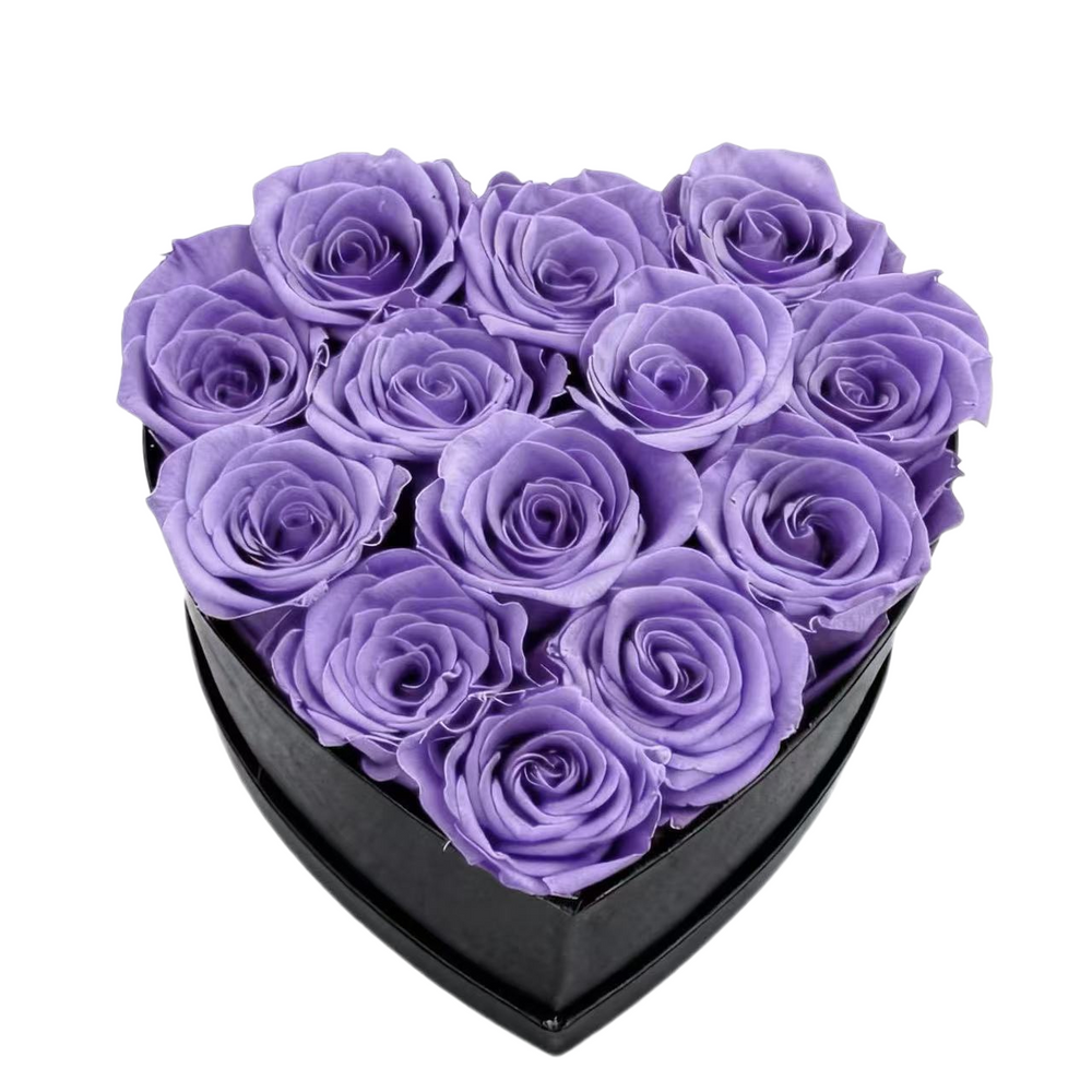 A luxurious heart box filled with 13 or 20 handcrafted forever roses, featuring a Parisian black hat-box design with gold detailing. Bloom 3+ years.