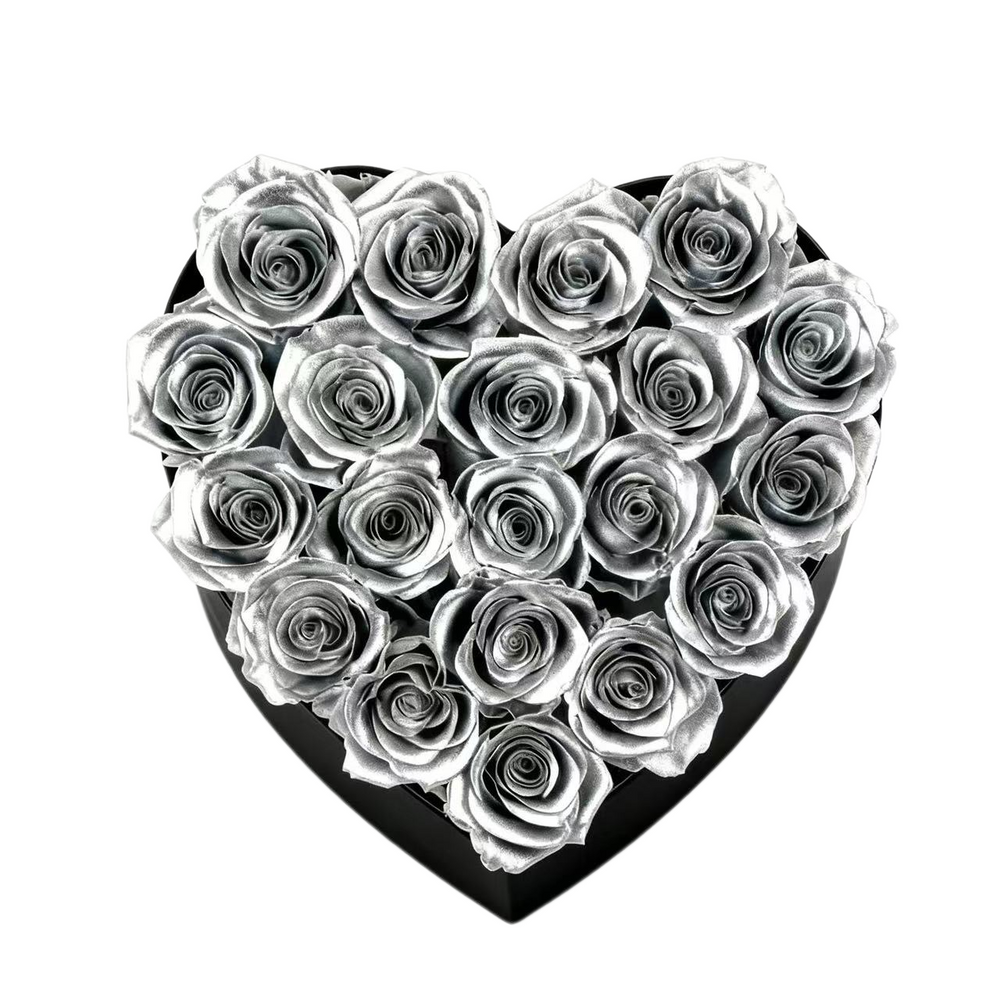 A luxurious heart box filled with 13 or 20 handcrafted forever roses, featuring a Parisian black hat-box design with gold detailing. Bloom 3+ years.