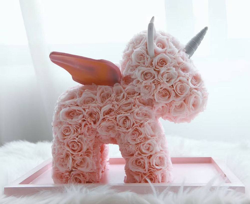 Luxury preserved rose unicorn in sweet pink, handcrafted with dozens of delicate roses. Perfect for Valentine’s Day, birthdays, baby showers, or home décor. Bloom 3+ years.