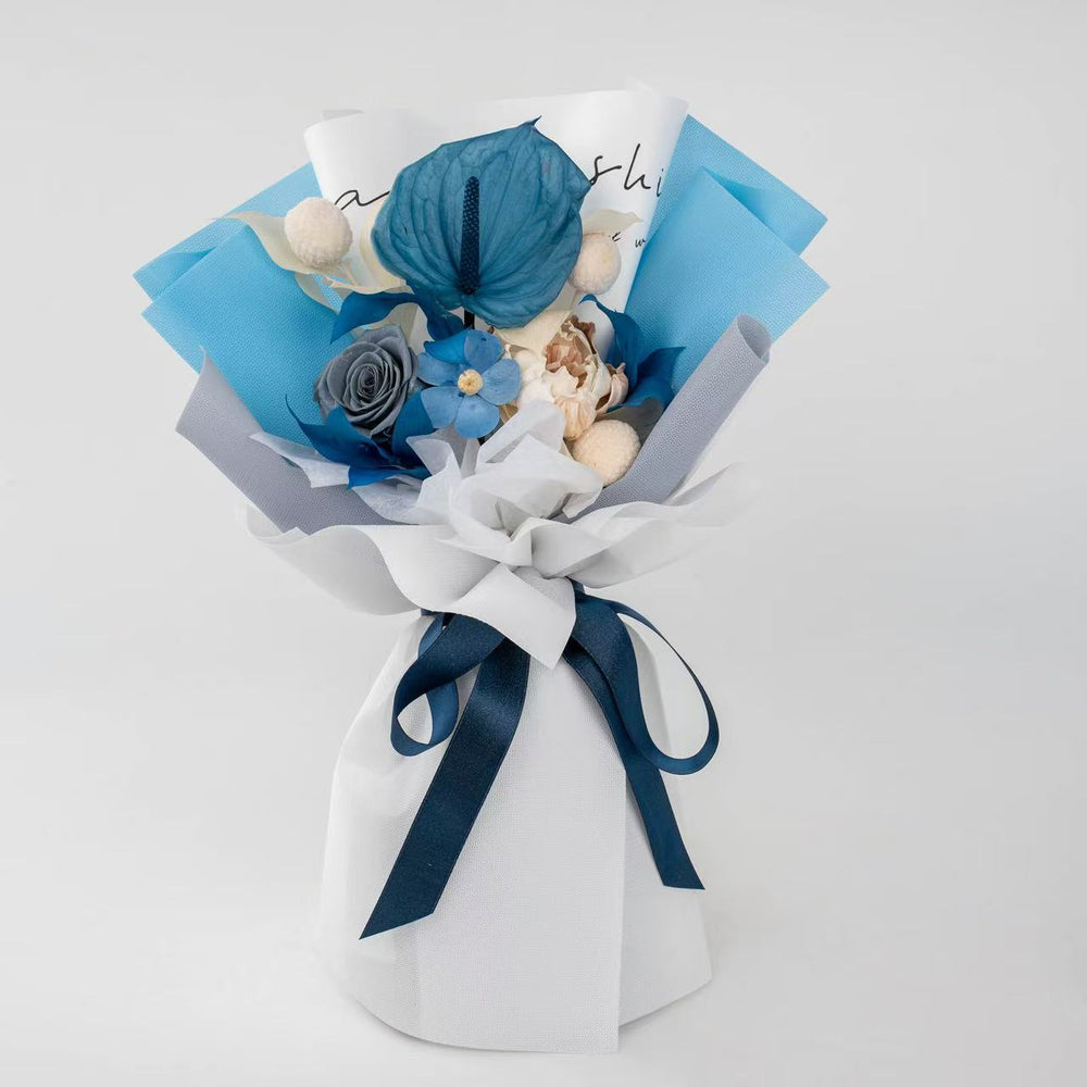 This elegant preserved flower bouquet features vibrant anthuriums, roses, and soft hydrangeas wrapped in rich tones. A perfect long-lasting gift for birthdays, anniversaries, or fall celebrations — exuding warmth, luxury, and timeless beauty in every detail.