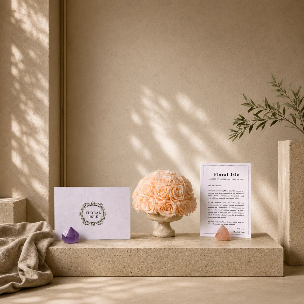 Champagne-preserved rose arrangement styled in a sculptural travertine funnel vase.
